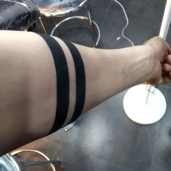 The 2 Lines Tattoo Meaning And The 32 Tattoos To Help You Line Up Your Next Ink